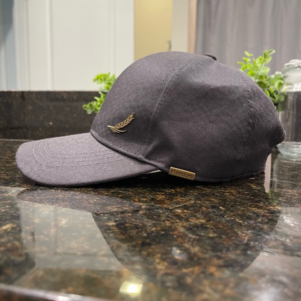 Black Baseball Cap with Gold Feather Logo